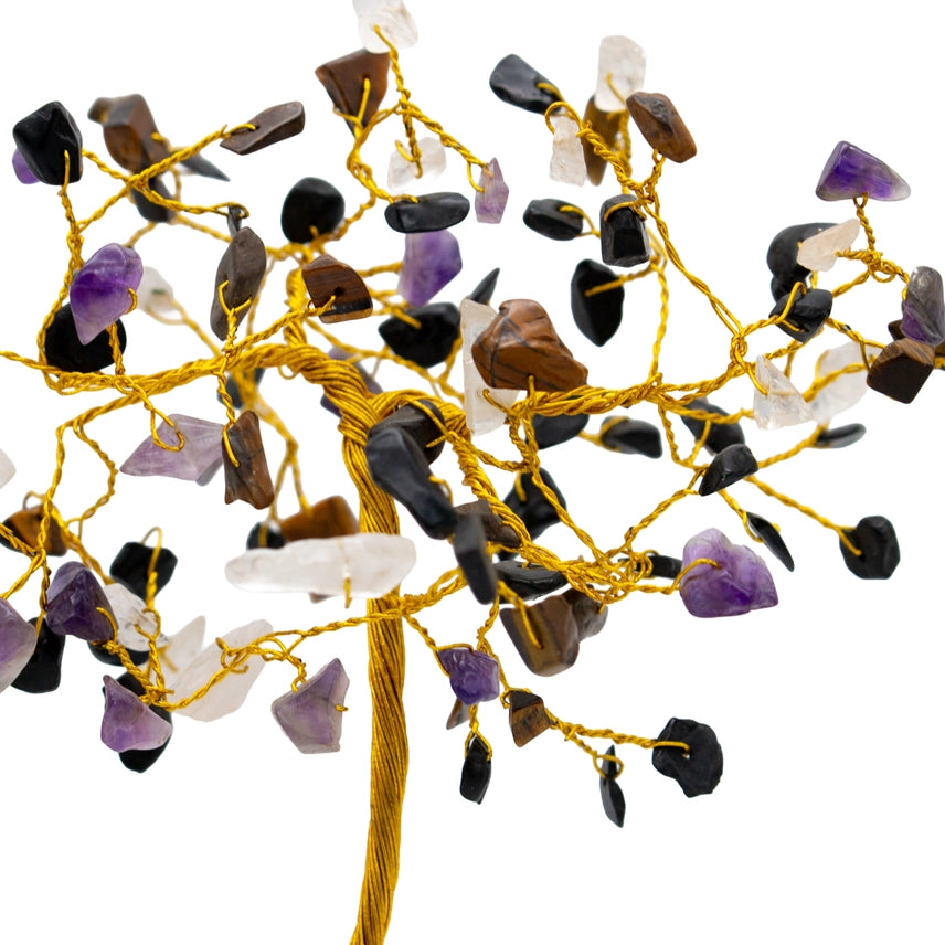 Decorative string with multicolored stones on a white background